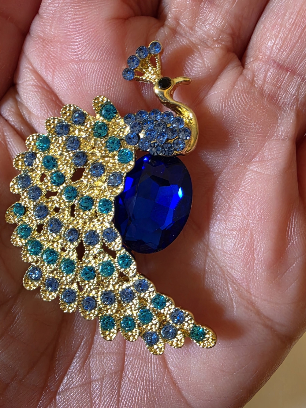 Gold Peacock Brooch with Blue and Teal Crystals